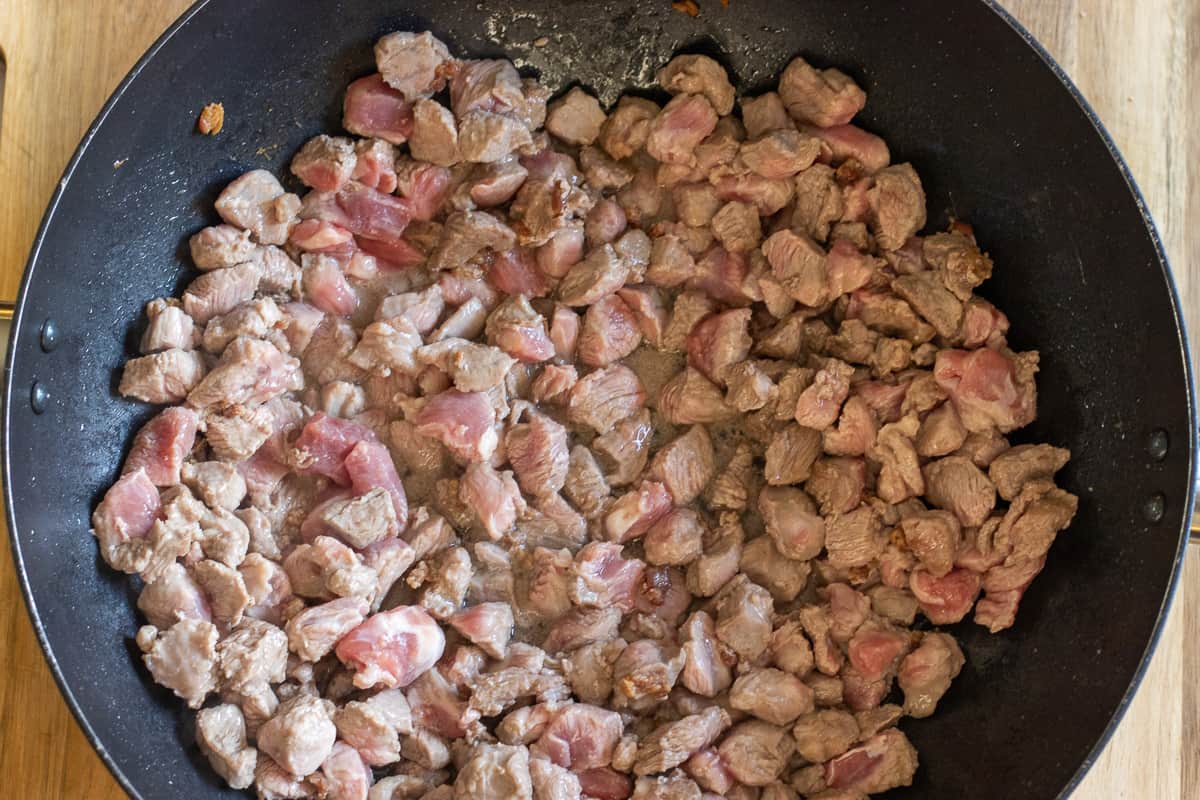 Sautéing the lamb with rendered fat