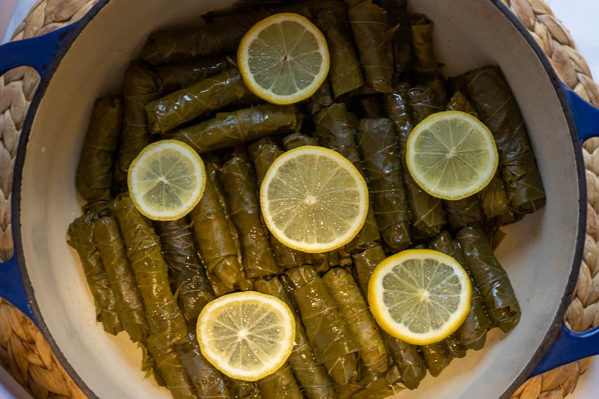 yaprak sarma, stuffed grape leaves arranged in a dutch oven