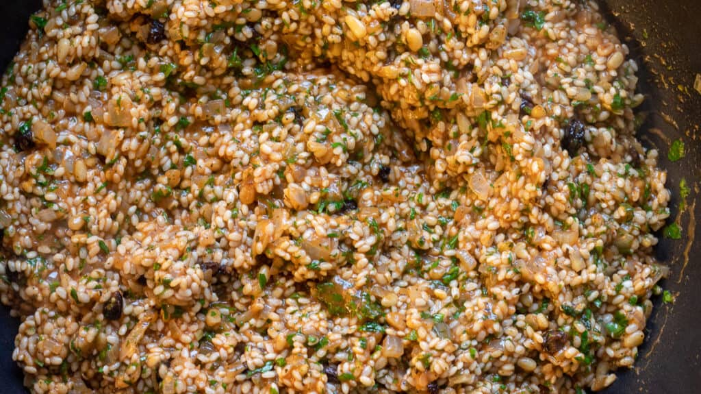 The rice filling is ready for stuffing the peppers.
