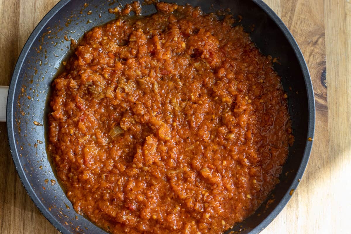 the sauce mixture is cooked until the tomatoes are softened