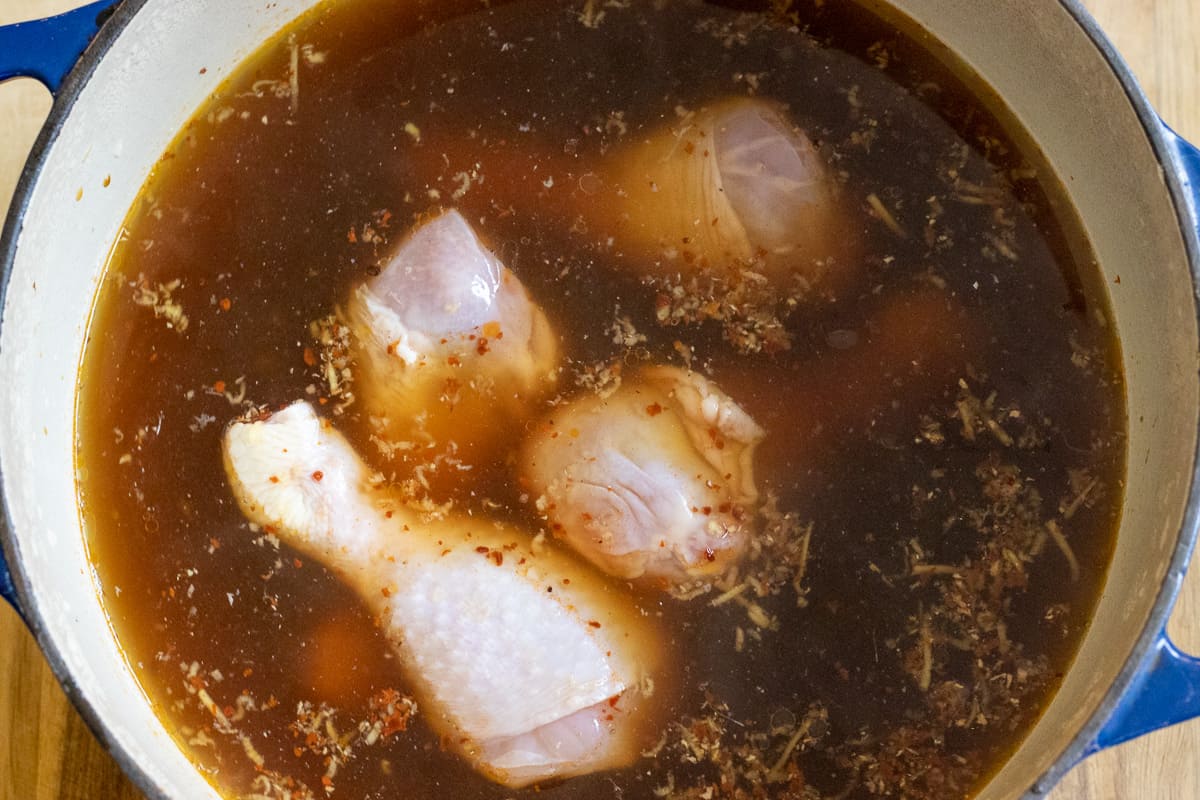 Simmering the chicken in stock