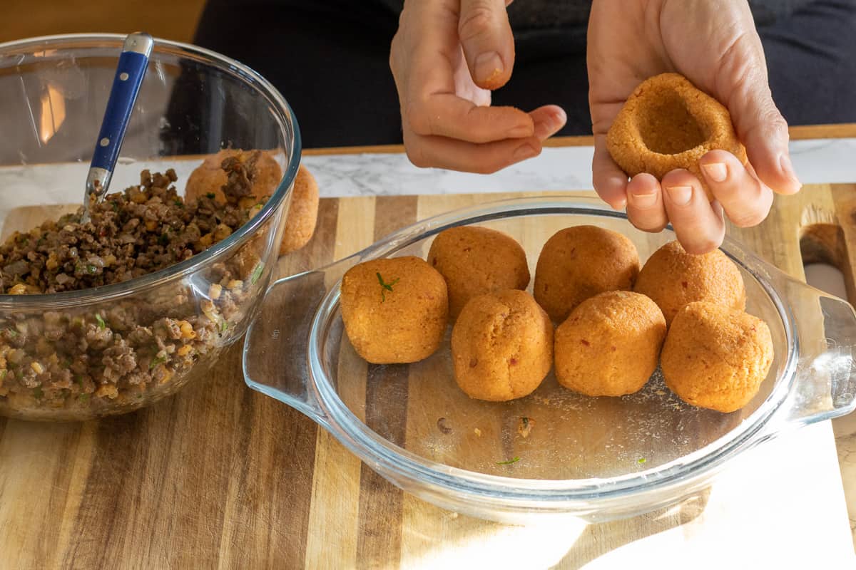 making an indent in the middle of the bulgur ball