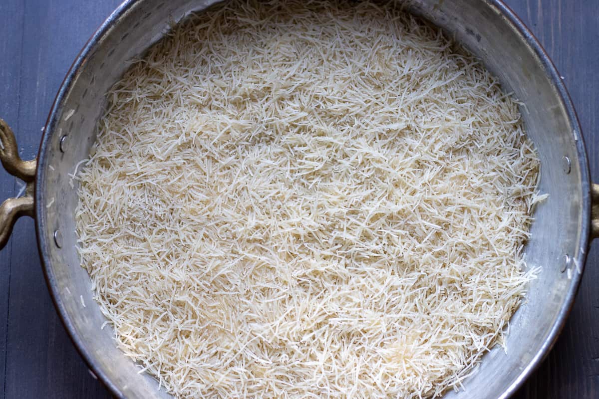 spread half of the kadayif on the pan