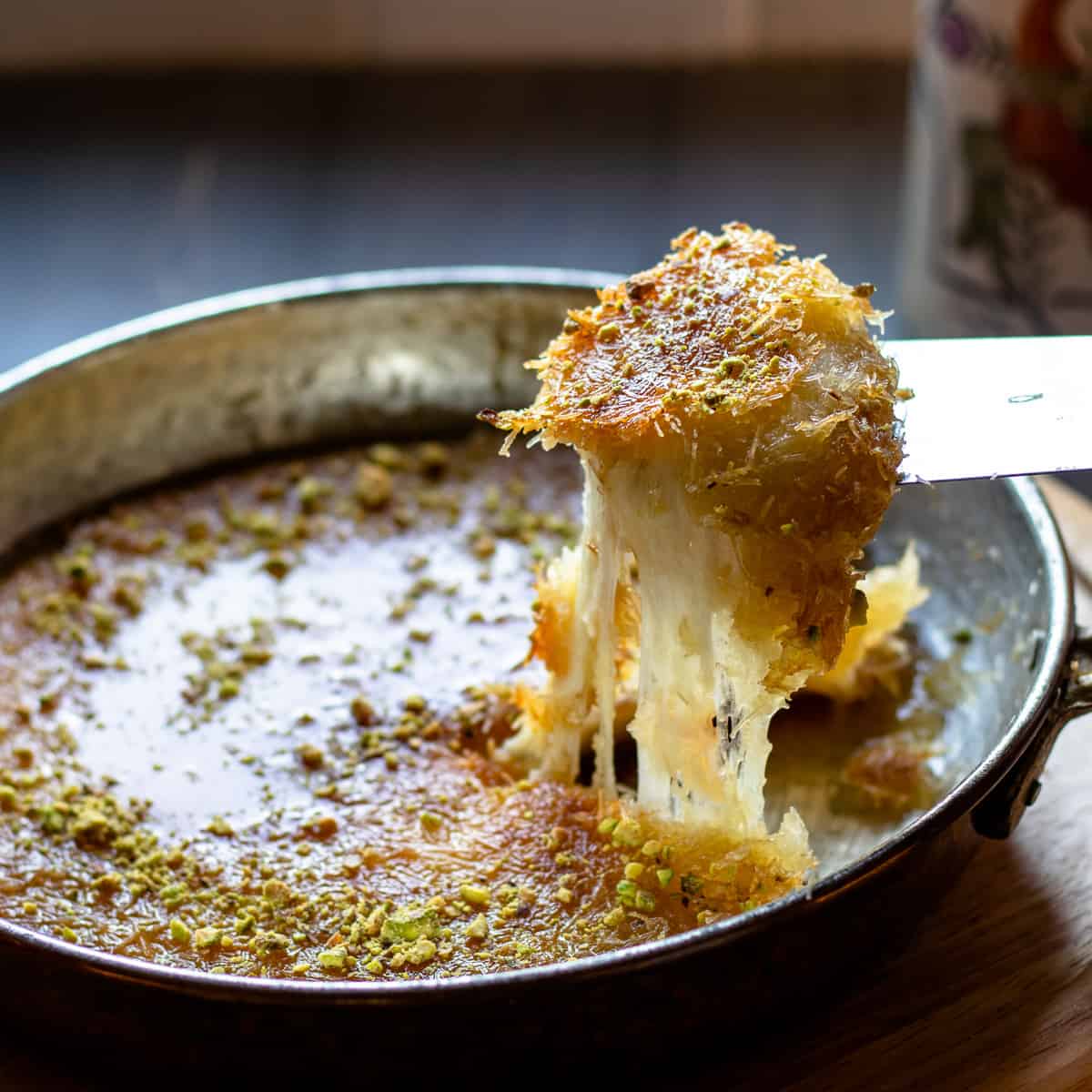a slice of Kunefe turkish cheese dessert