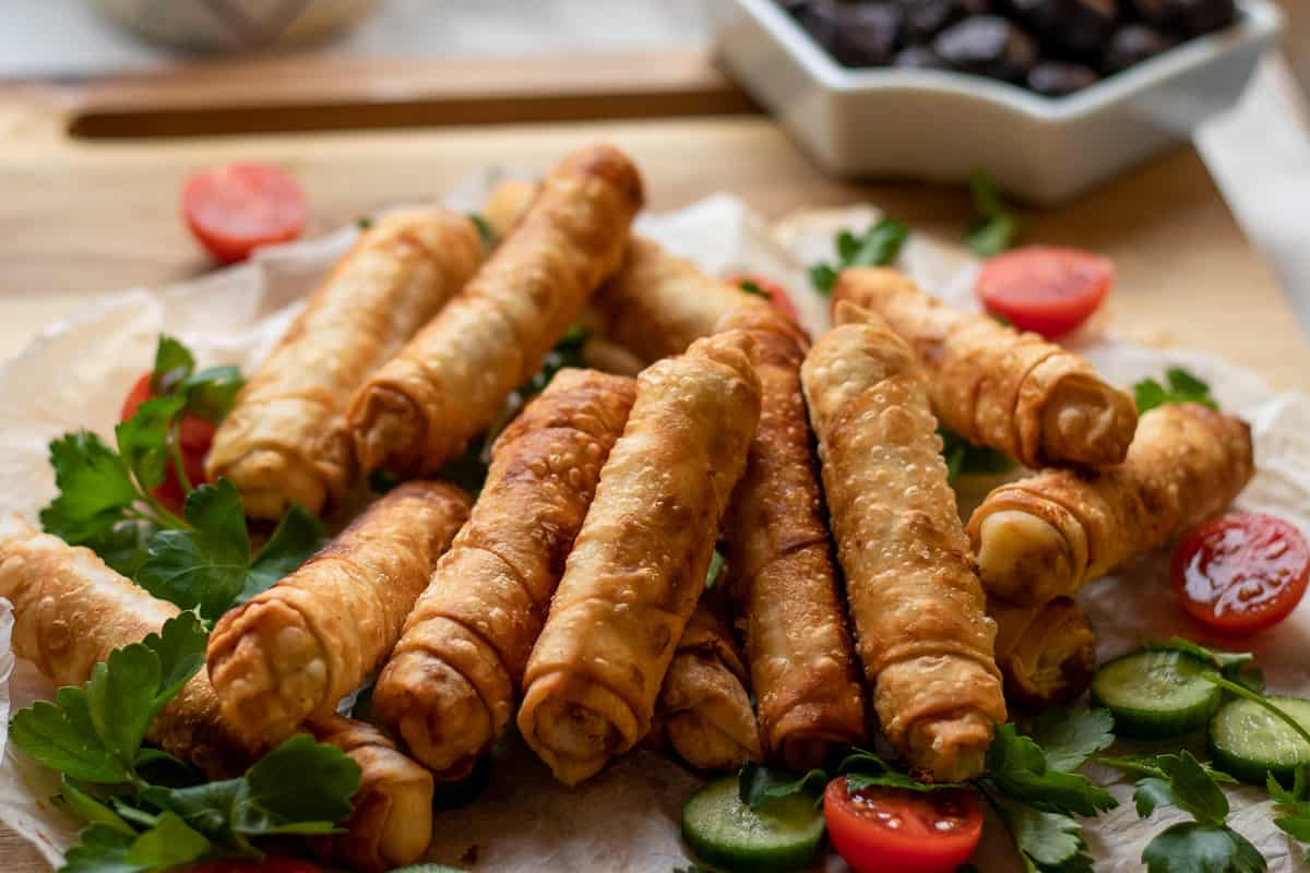 Pacanga boregi served with salad and olives