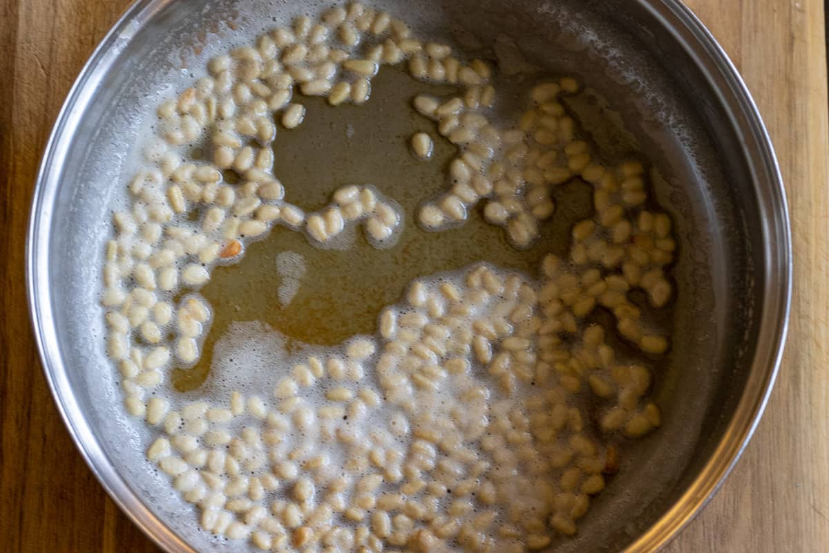 sautéing the pine nuts with olive oil
