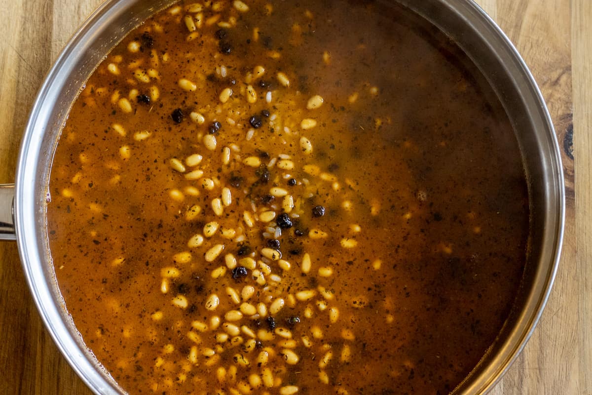 the chicken stock is added to the rice