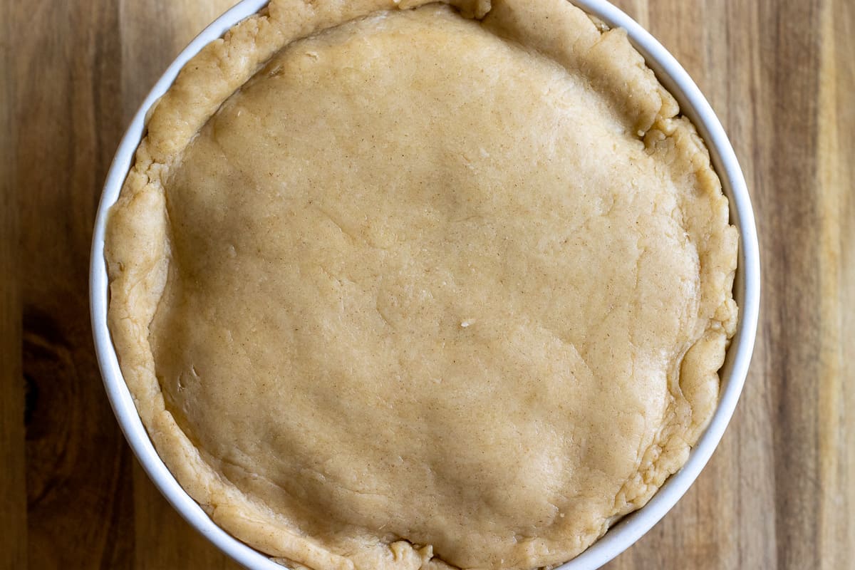 over hanging pastry is folded over the filling