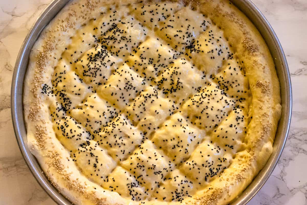 pide bread is glazed with egg yolk and yoghurt