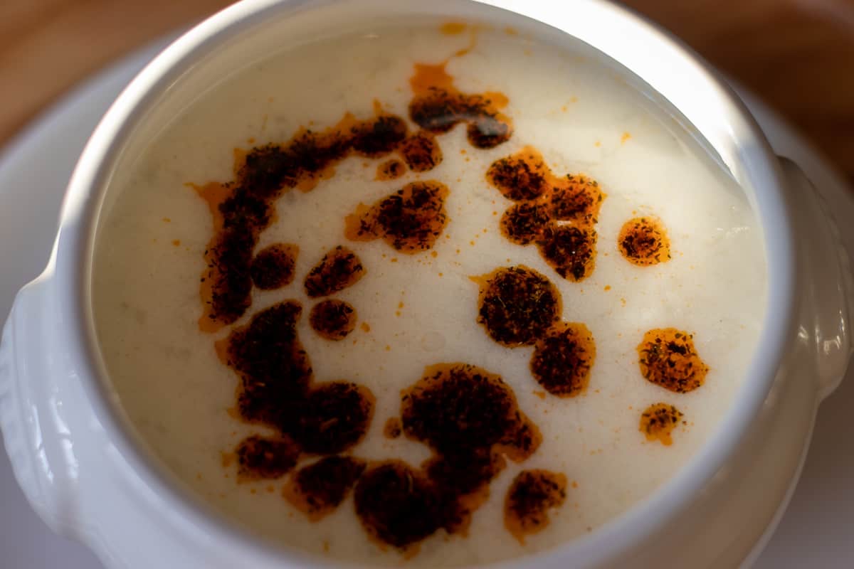 Yayla corbasi served with a drizzle of mint sauce