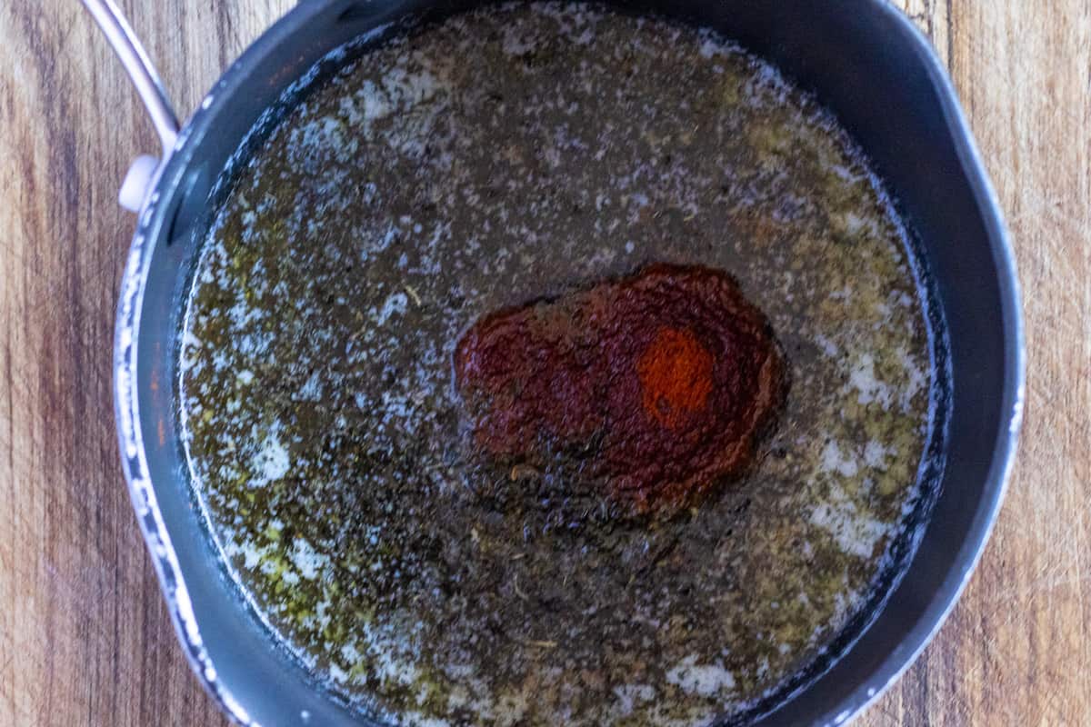 butter is melted and mixed with mint and paprika