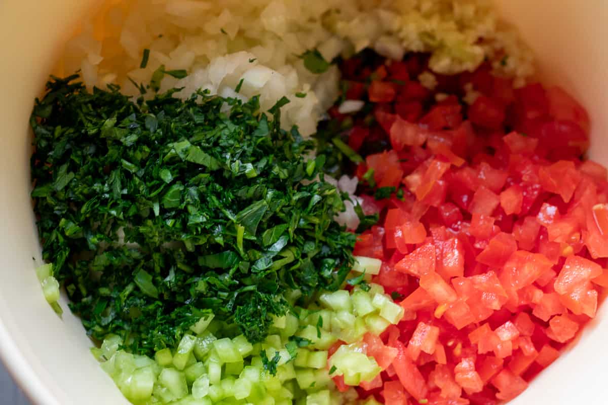 vegetables are cut into small pieces and placed in a bowl