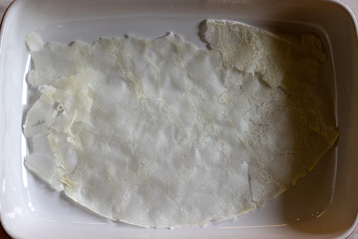 a sheet of Gullac leaf is layered on a baking dish