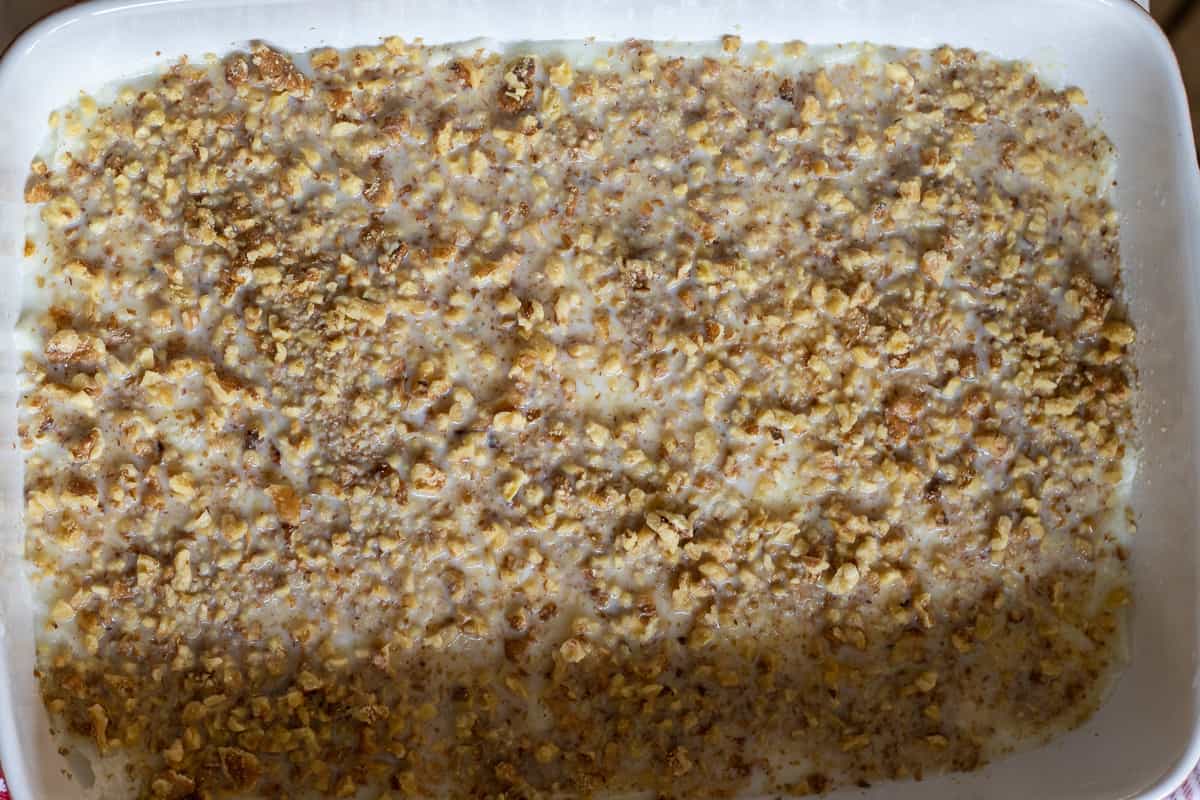 chopped nuts are sprinkled on milk soaked gullac leaves