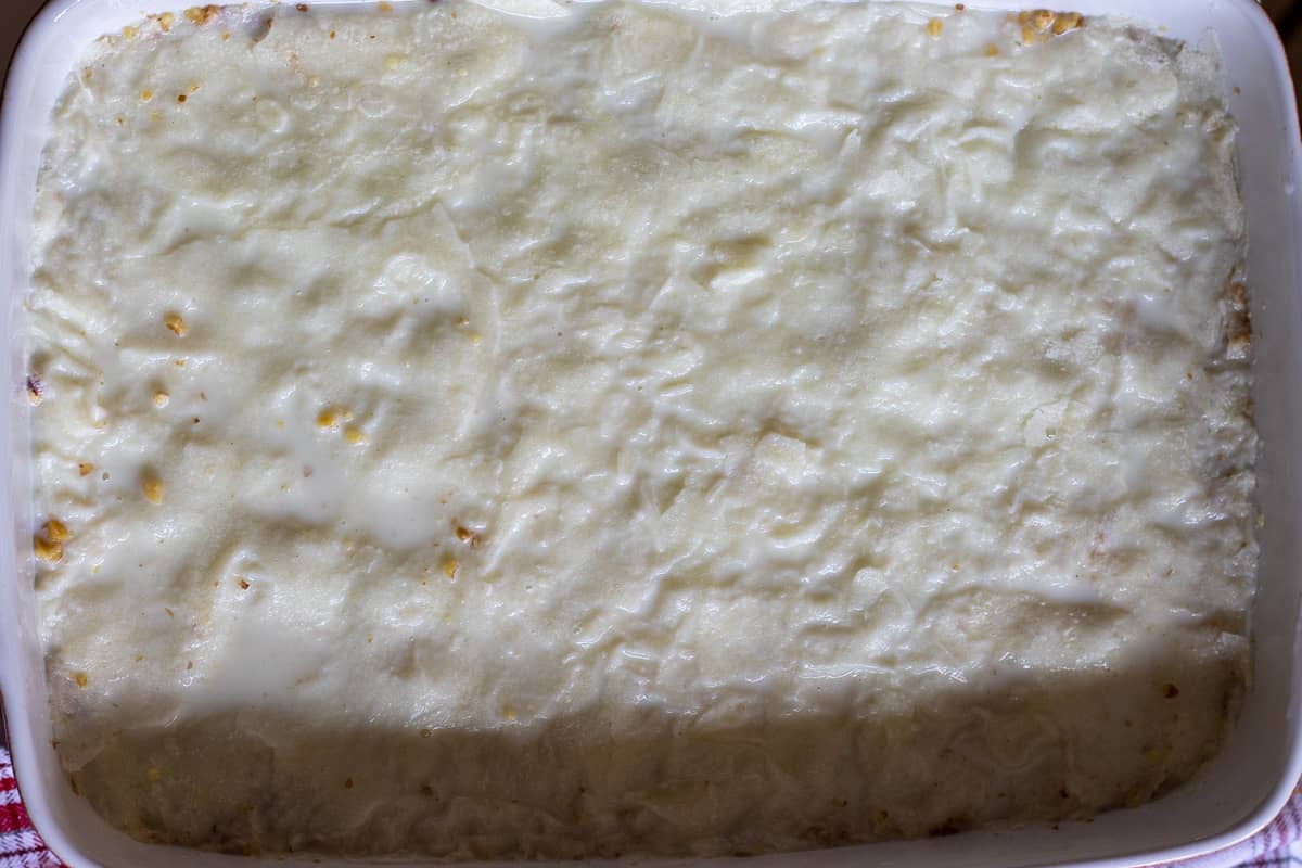 The other 5 gullac sheets are layered on chopped nuts