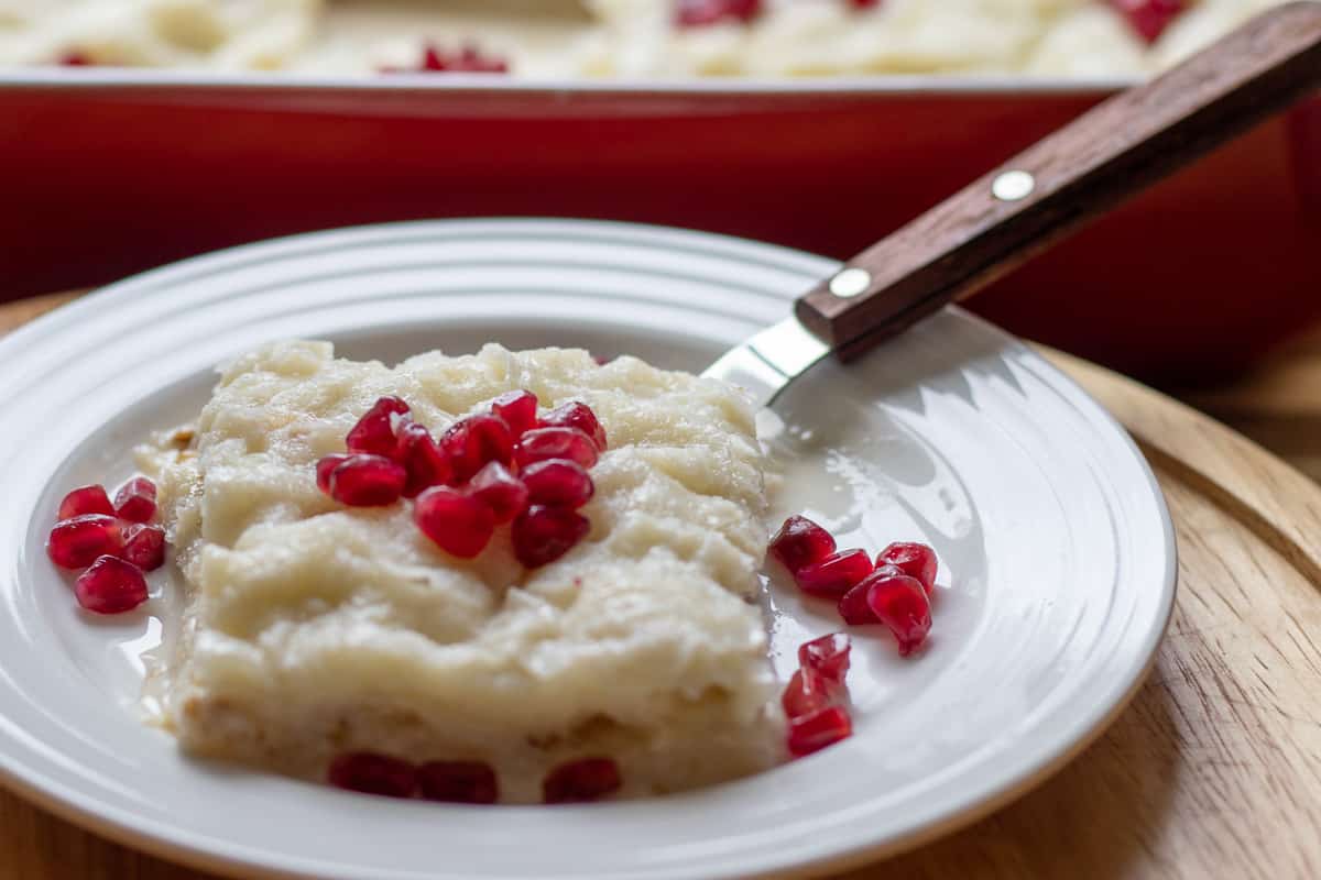 one portion of Gullac serve with extra pomegranate seeds