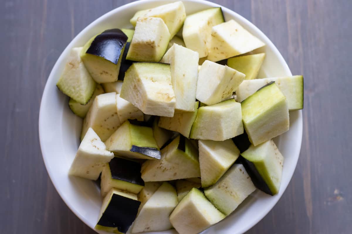 peeled aubergines are cut in cubes
