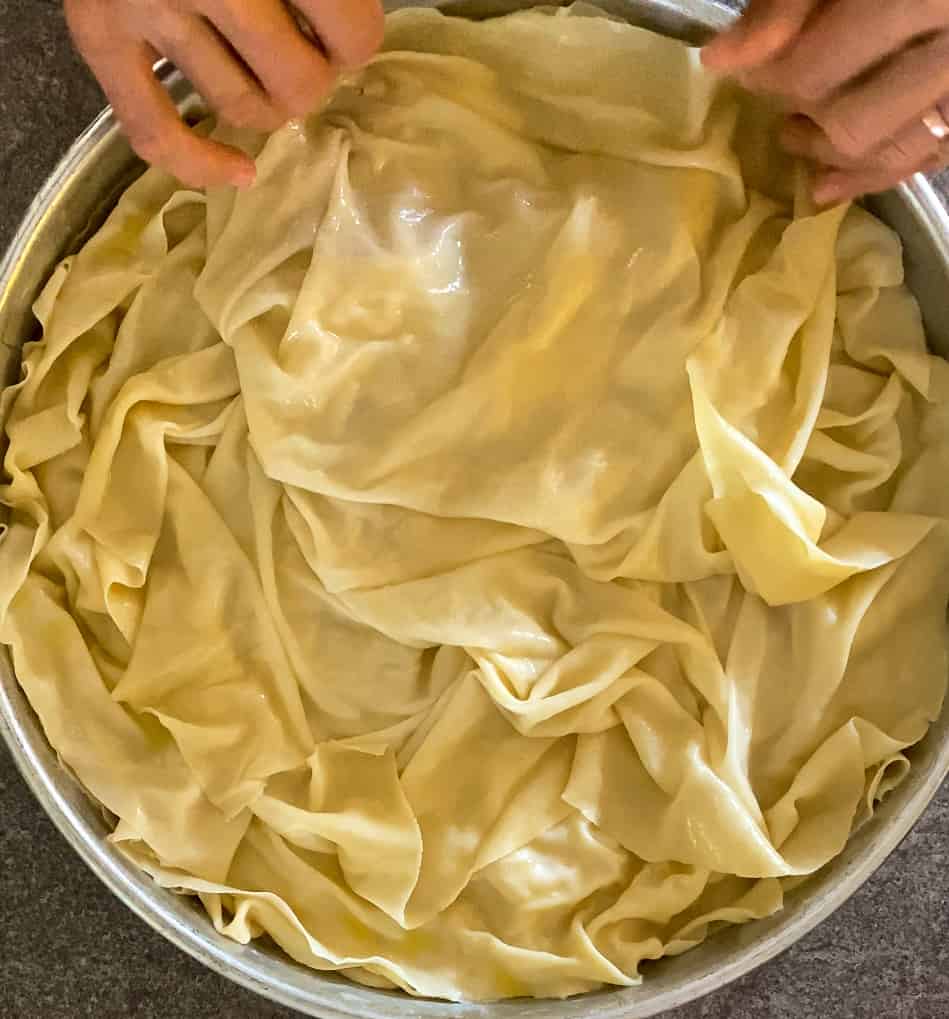 layer the blanched yufka sheet on top