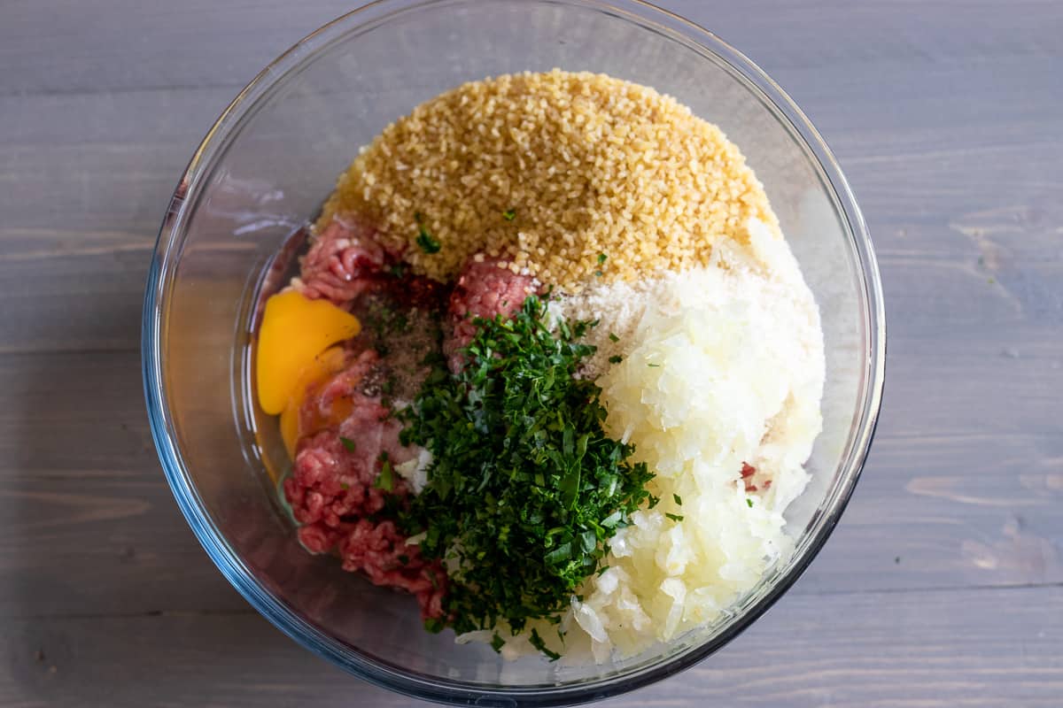 the meatball ingredients are placed in a bowl