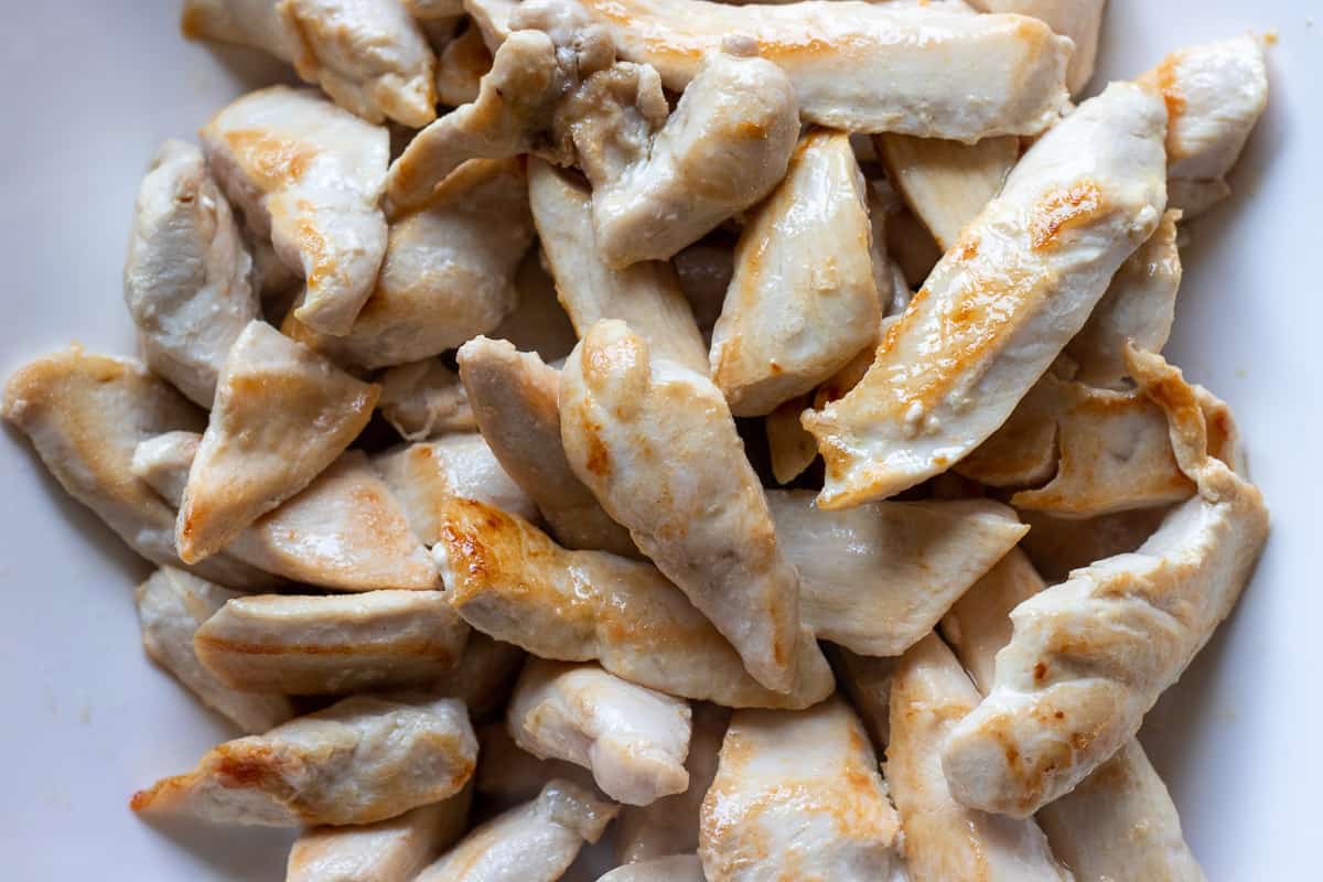 the cooked chicken pieces are removed on a plate