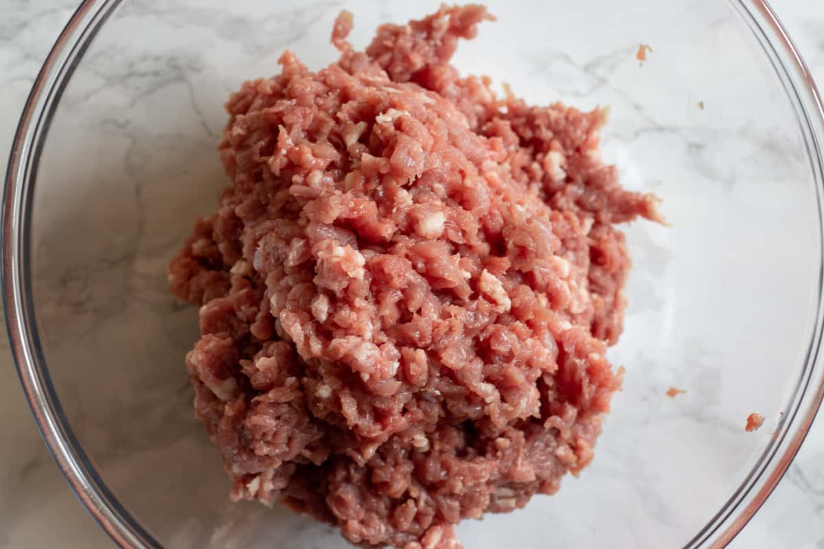 hand chopped lamb meat in a glass bowl