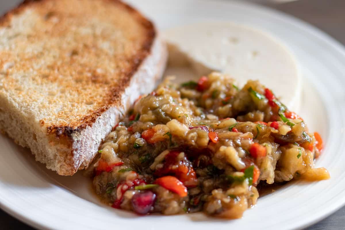 Baba ganoush served with crusty bread and feta cheese