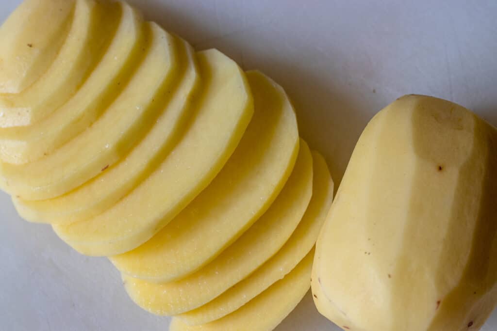 Peeled and sliced potatoes.