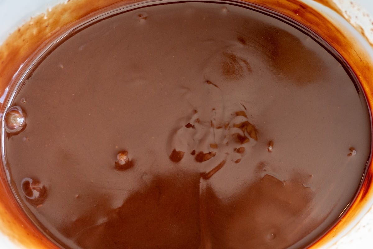 cream and chocolate are whisked until smooth and shiny