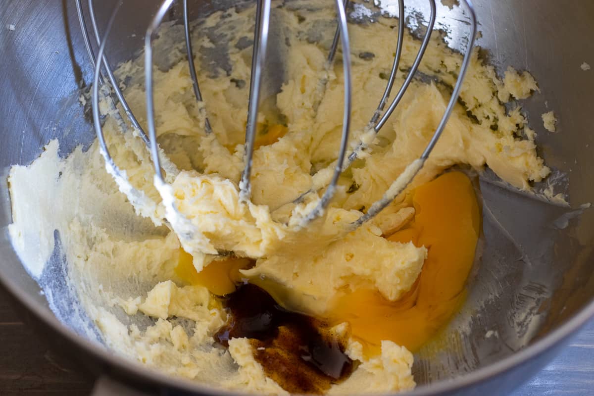 the egg and vanilla are added to whipped butter and sugar