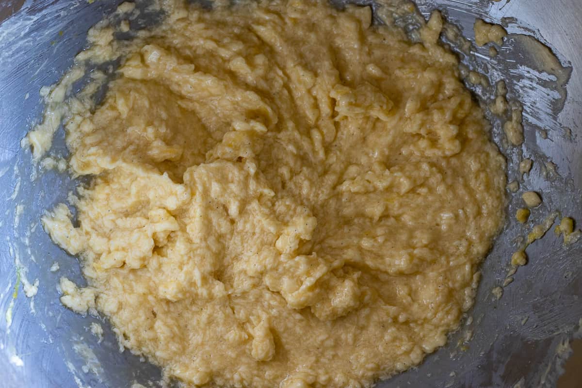 adding the flour to wet mixture and mixing until incorporated