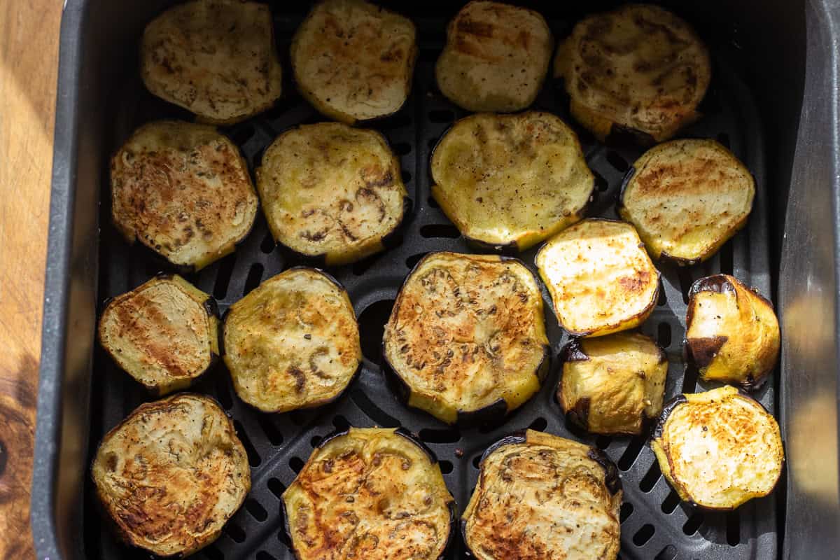 Sliced eggplants cooked in an air fryer.