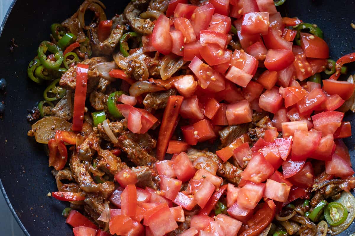 The tomatoes are added