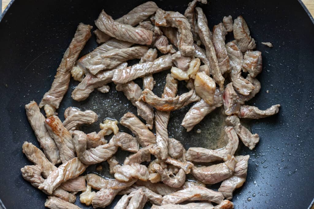 Sautéing the beef with olive oil and butter