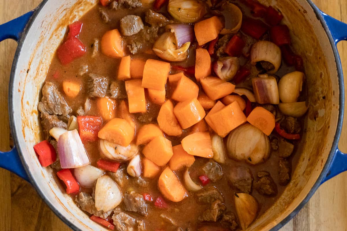 the stock is added to the dutch oven