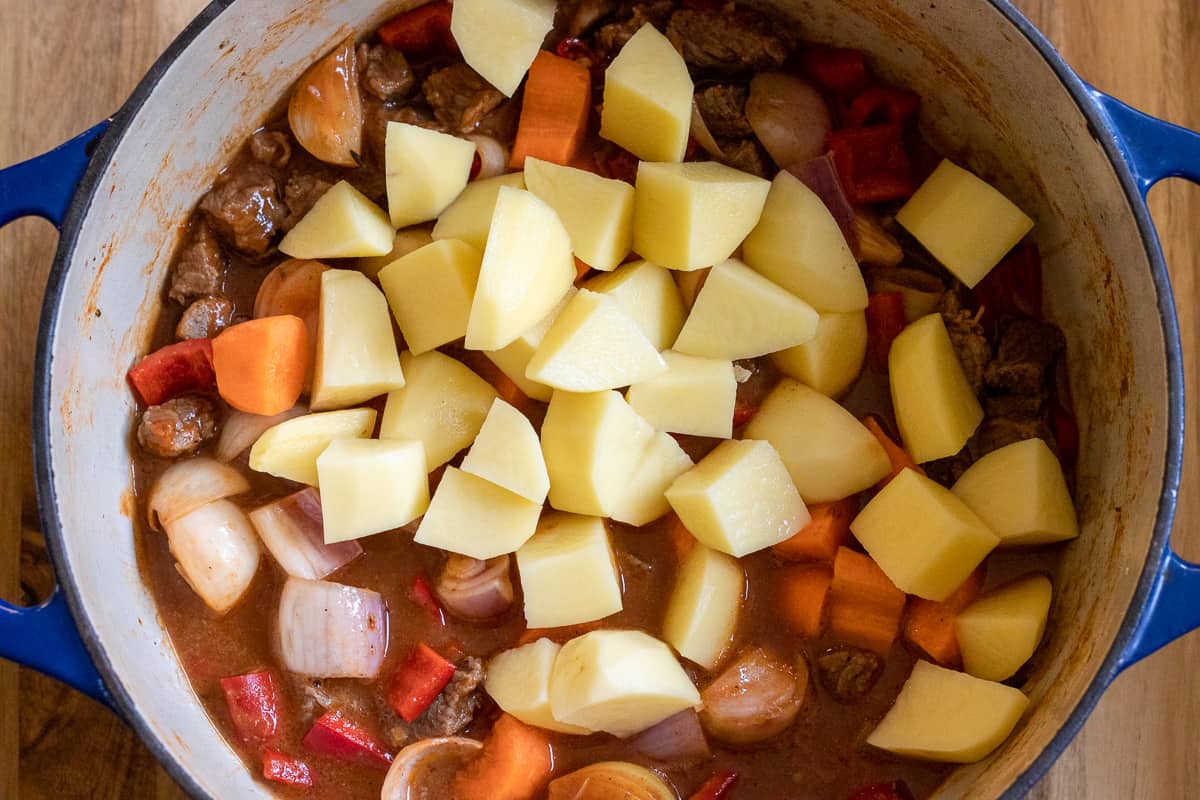 the potatoes are added to the Dutch oven