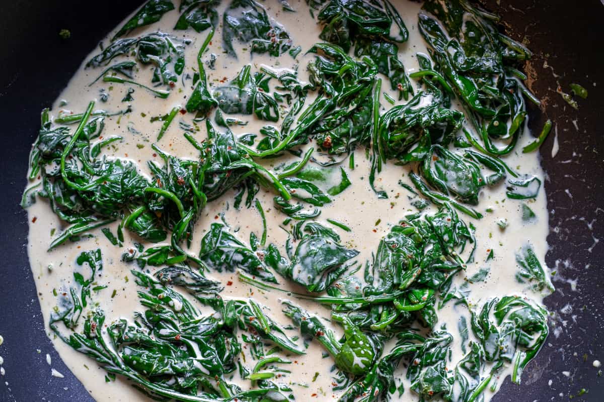 the cream, soy sauce and Worcestershire sauce are added to spinach