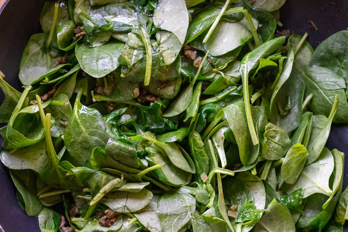 the spinach is added to the pan