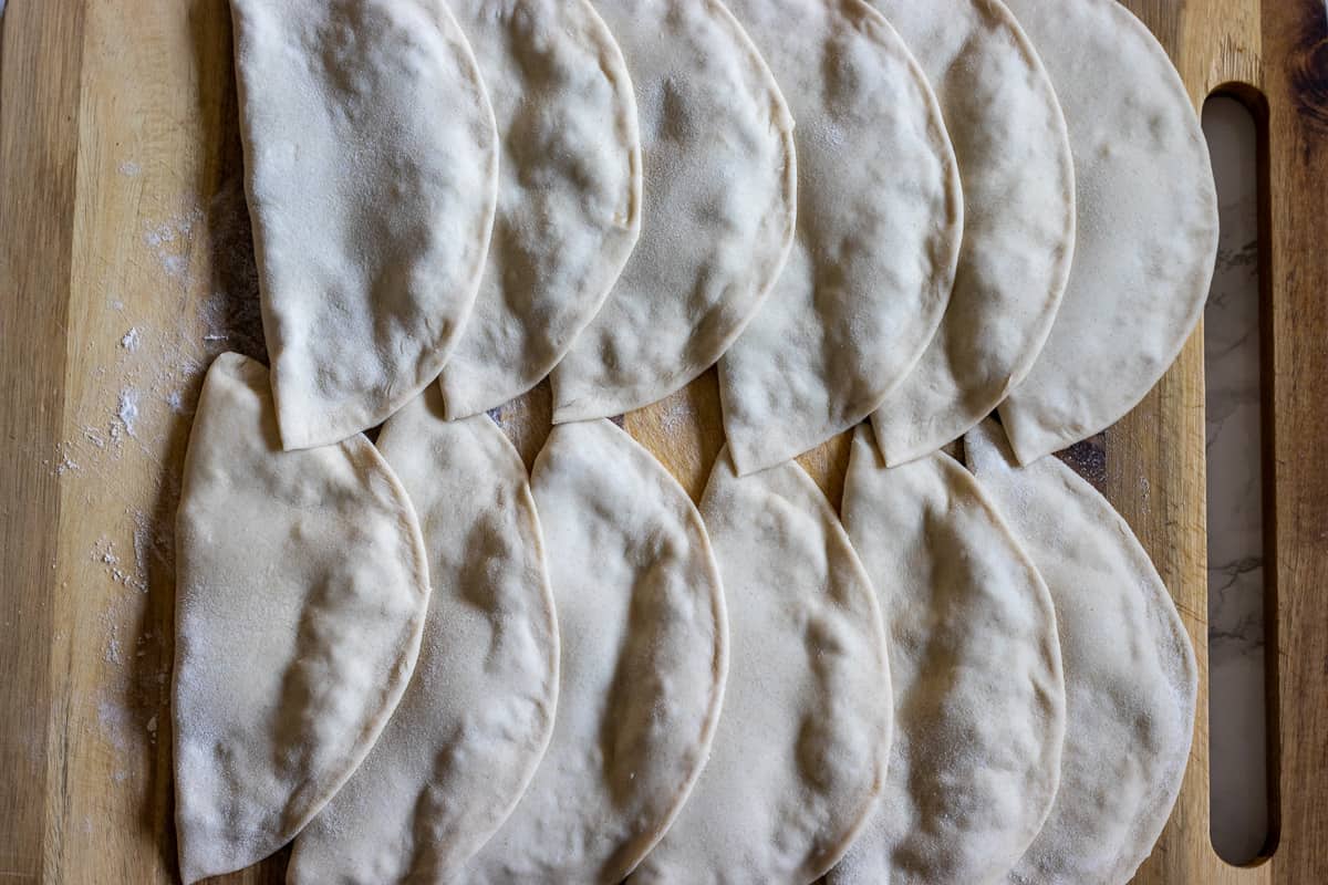 The pastries are set aside before frying