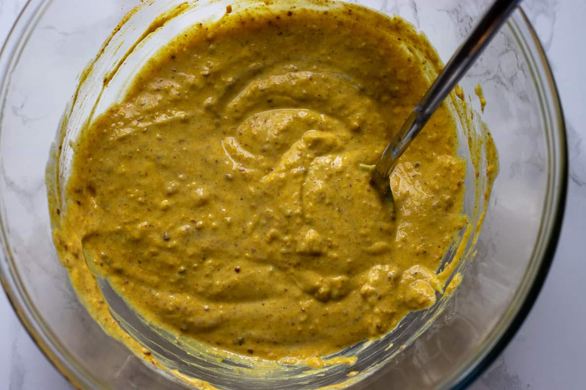 marinade ingredients are mixed in a glass bowl