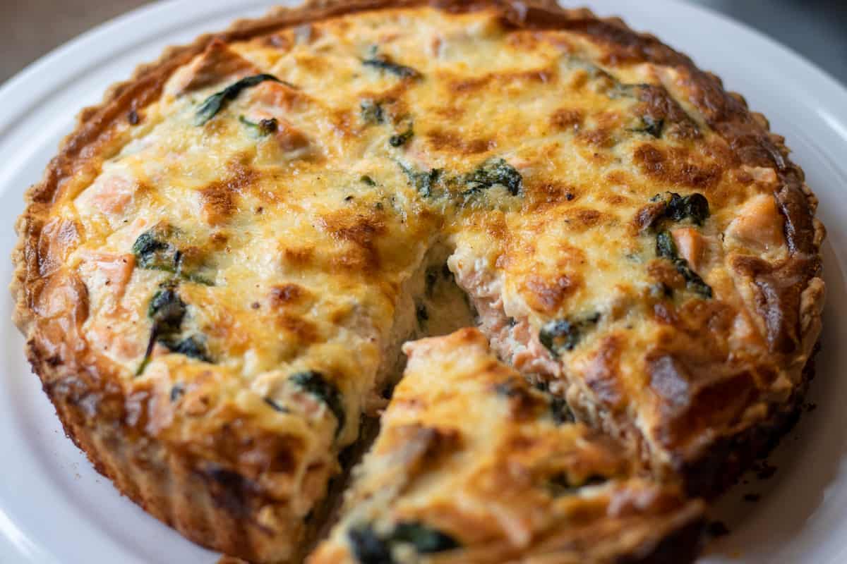 a slice of freshly baked quiche