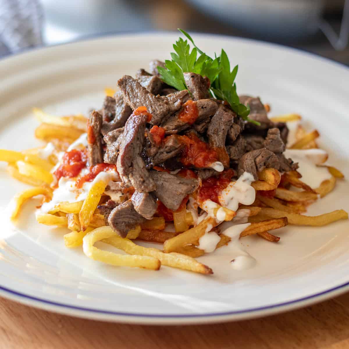cokertme kebabi served on a plate and garnished with parsley