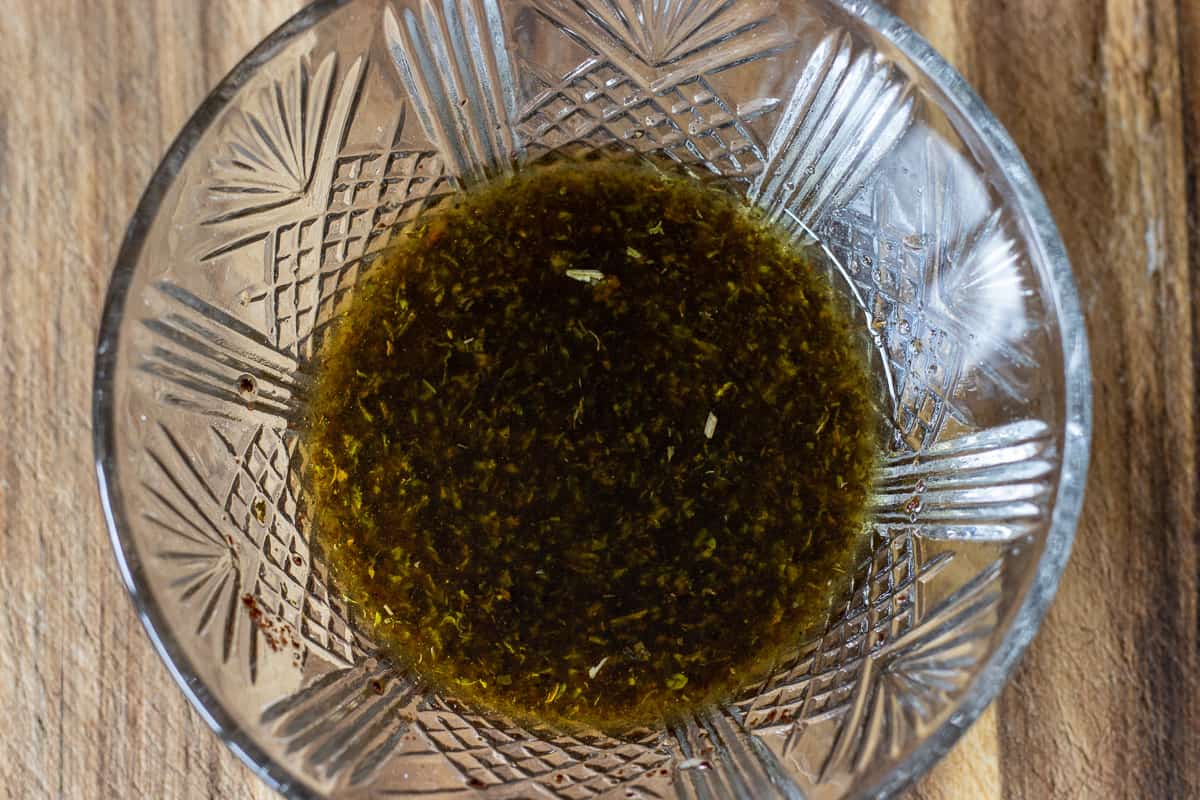 Ingredients for fattoush dressing mixed in a small bowl