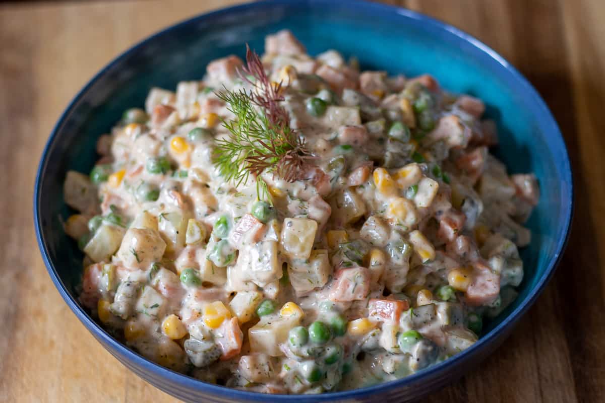 Russian Salad Olivier in a blue bowl