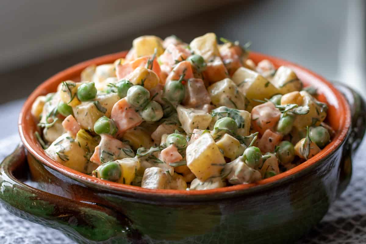 Russian salad served in a bowl