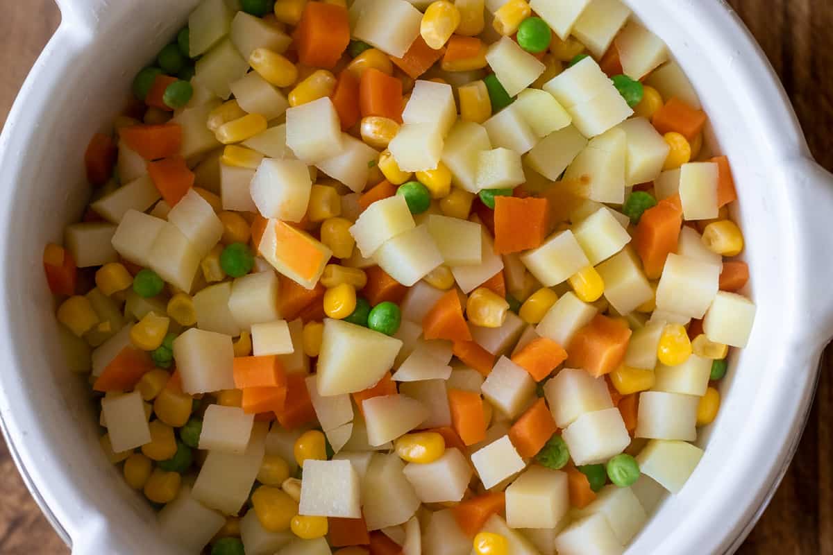 cooked vegetables are placed on a colander