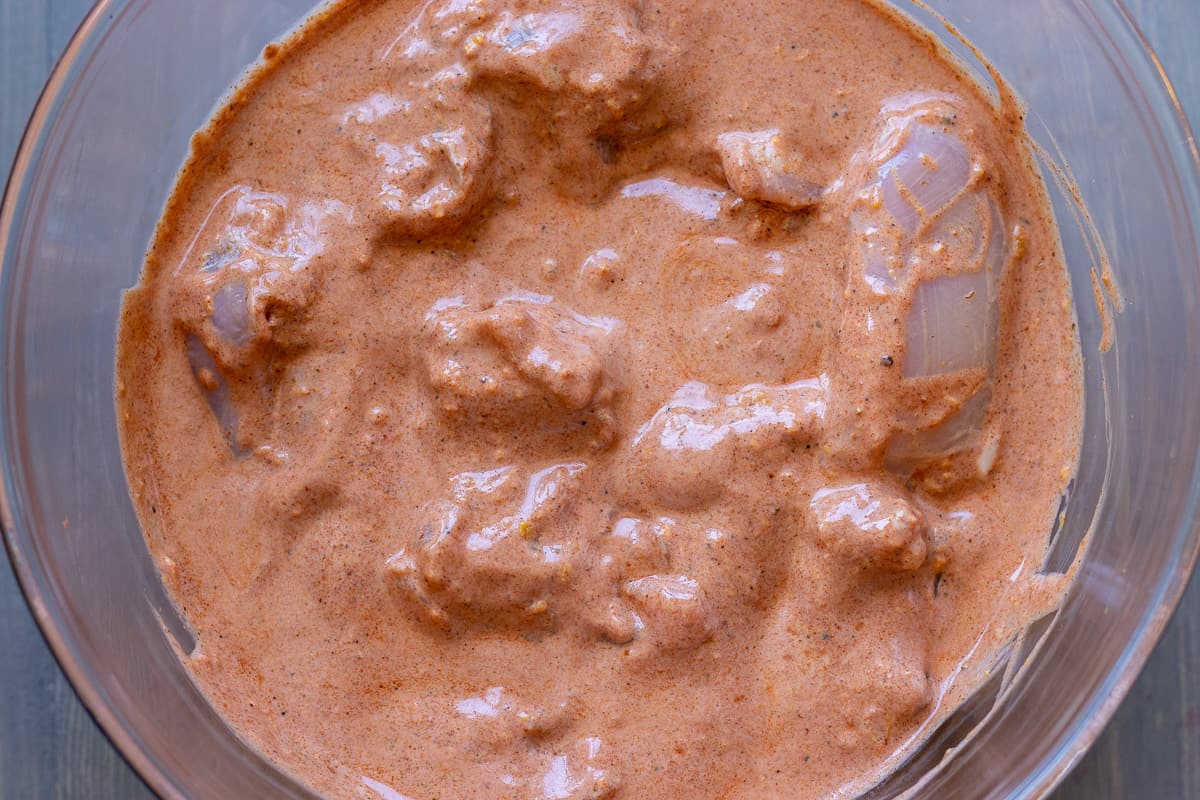 chicken thighs are covered with marinade