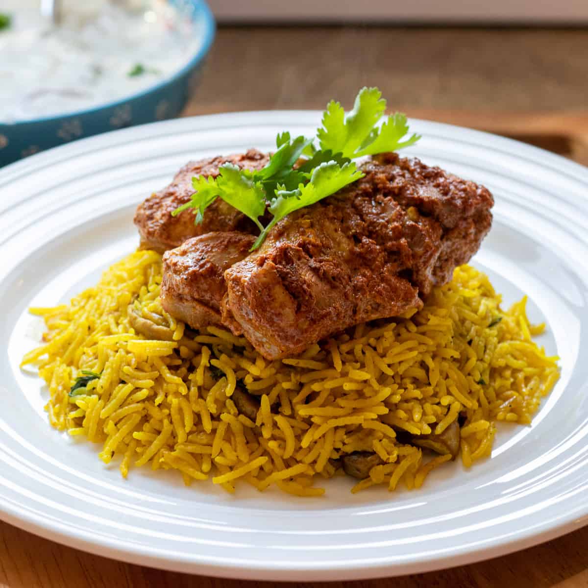 2 pieces of tandoori chicken thighs served on rice