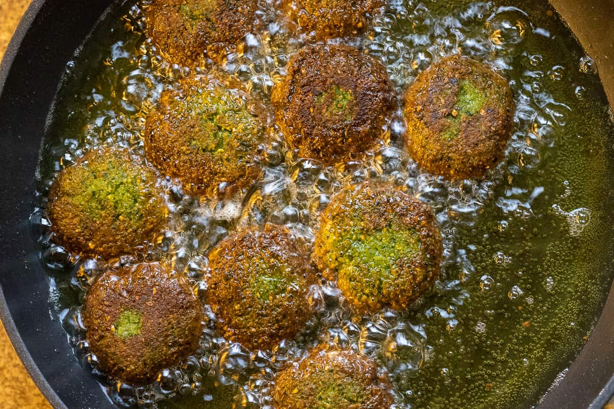 falafel patties are fried until golden brown