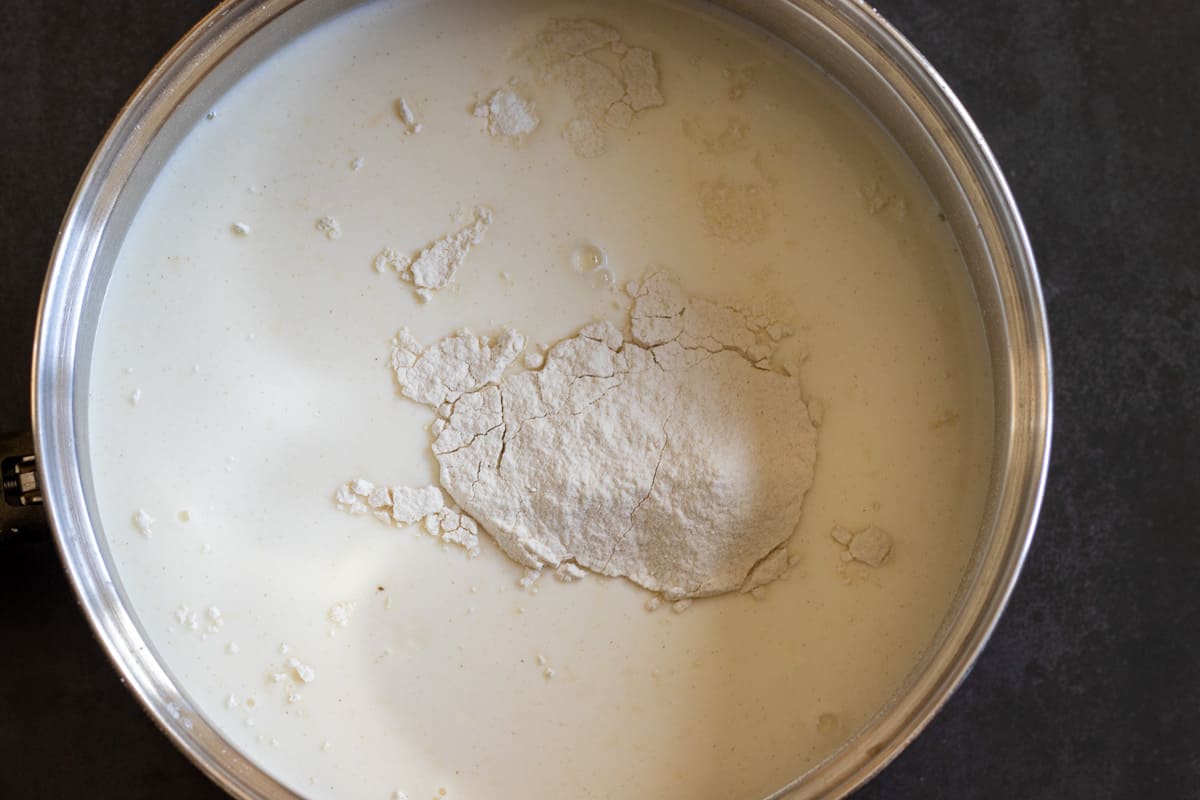 flour, sugar and wheat starch are added to the milk