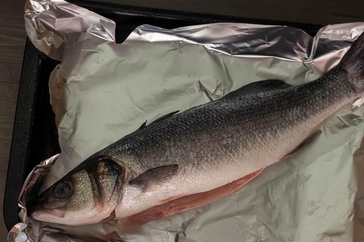 the whole sea bass is washed and pat dried